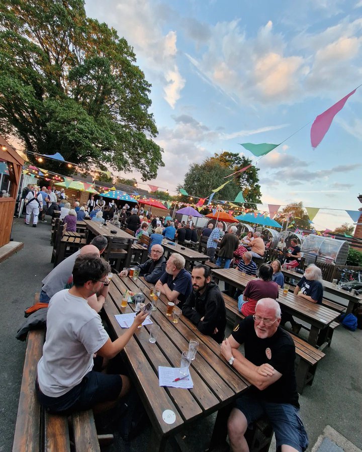 people enjoying an event in a beer garden