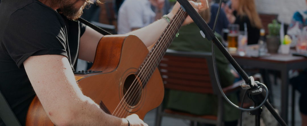 guitar being played in beer garden