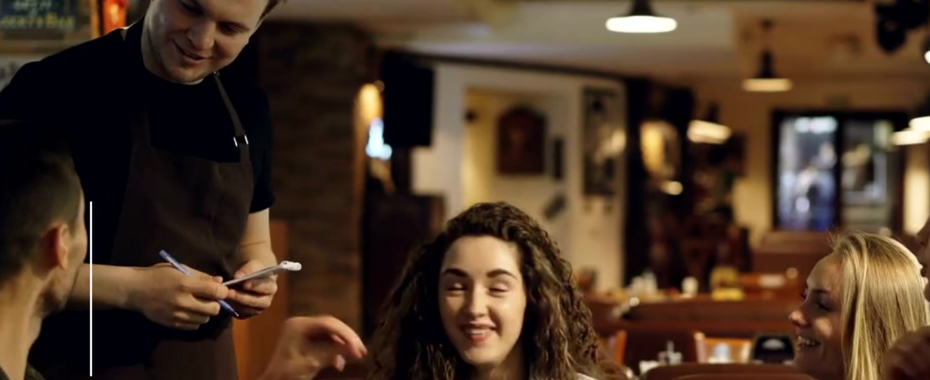 waiter taking an order in a pub