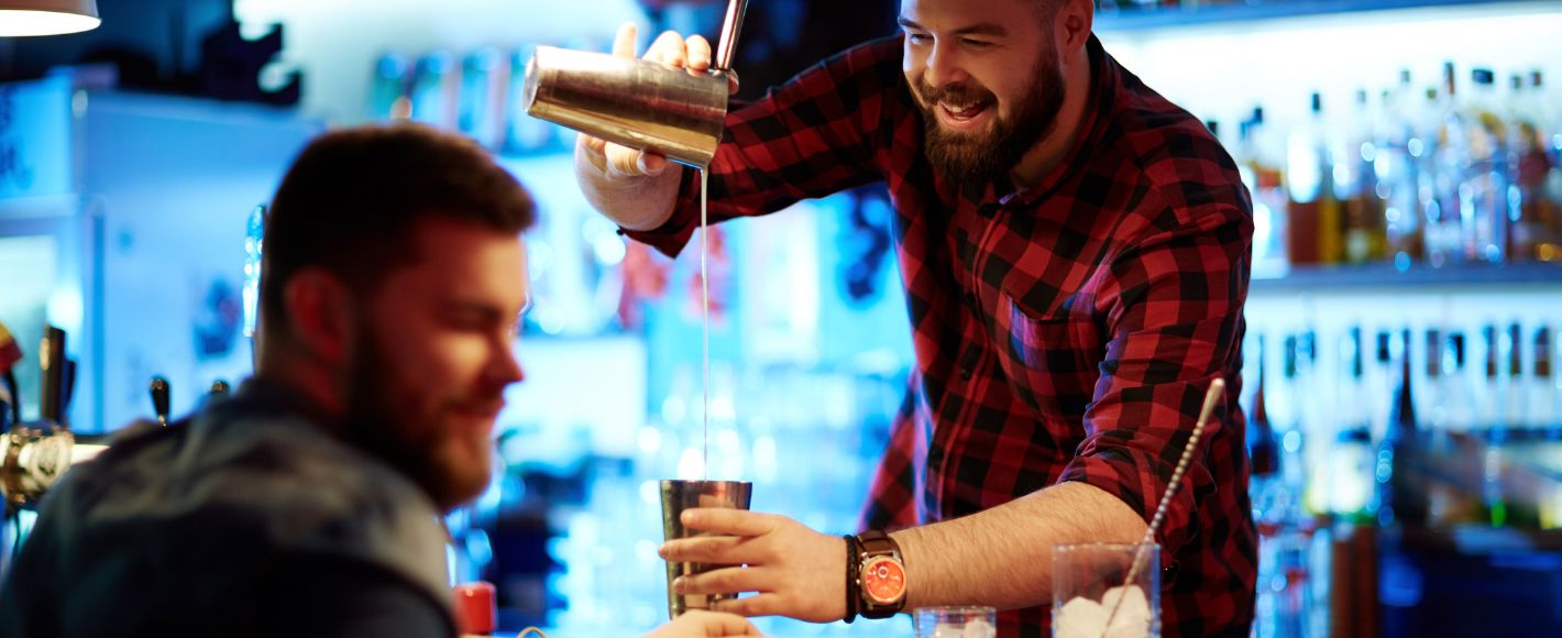 cocktail making behind the bar