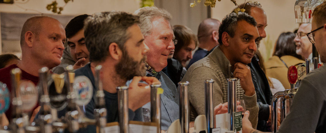 men at the bar in a pub