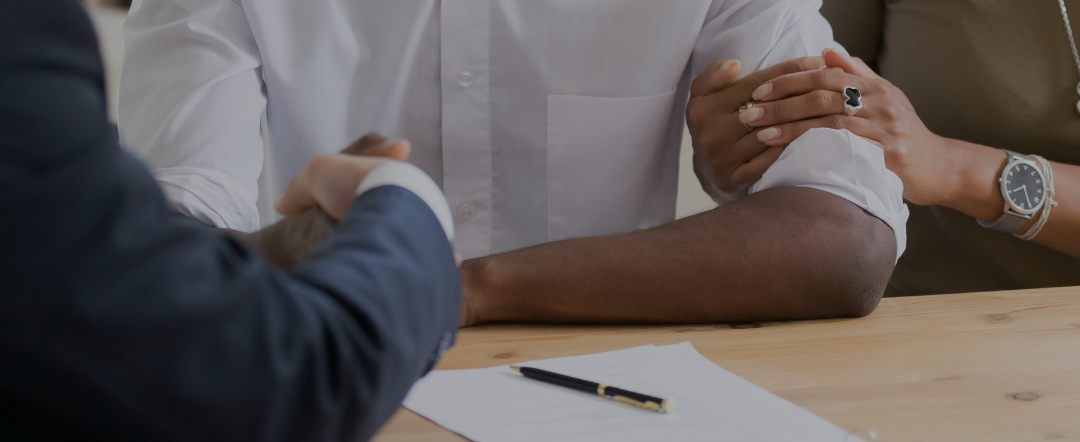 handshake over signing a document