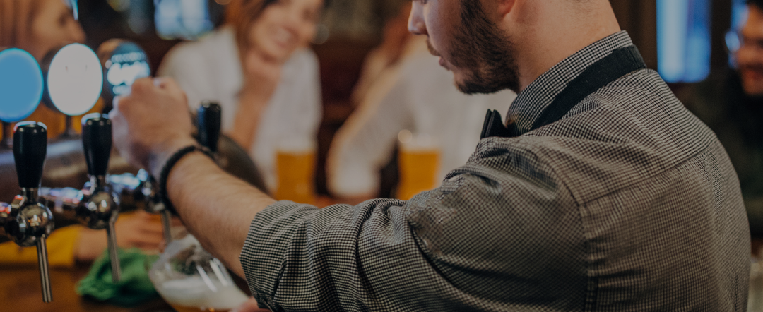 barman pulling a pint