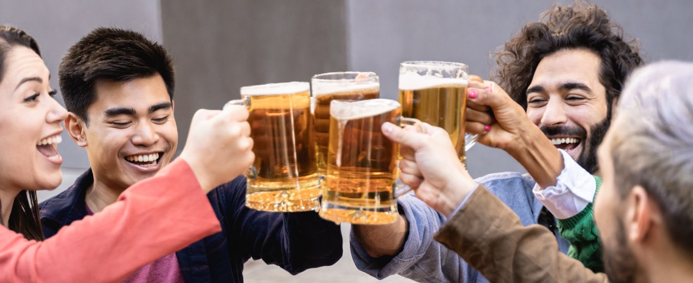 pints being toasted between friends