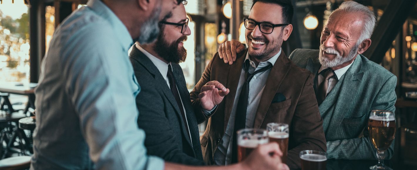 men at the bar laughung and drinking