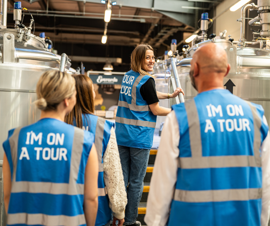 Tour guide taking people on a brewey tour