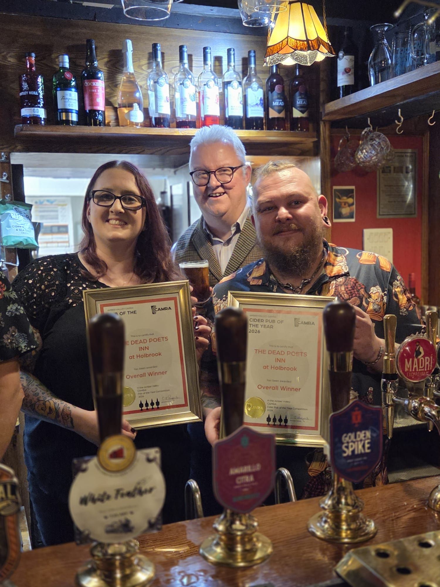 Dead Poets In staff holding their CAMRA Award Certificates