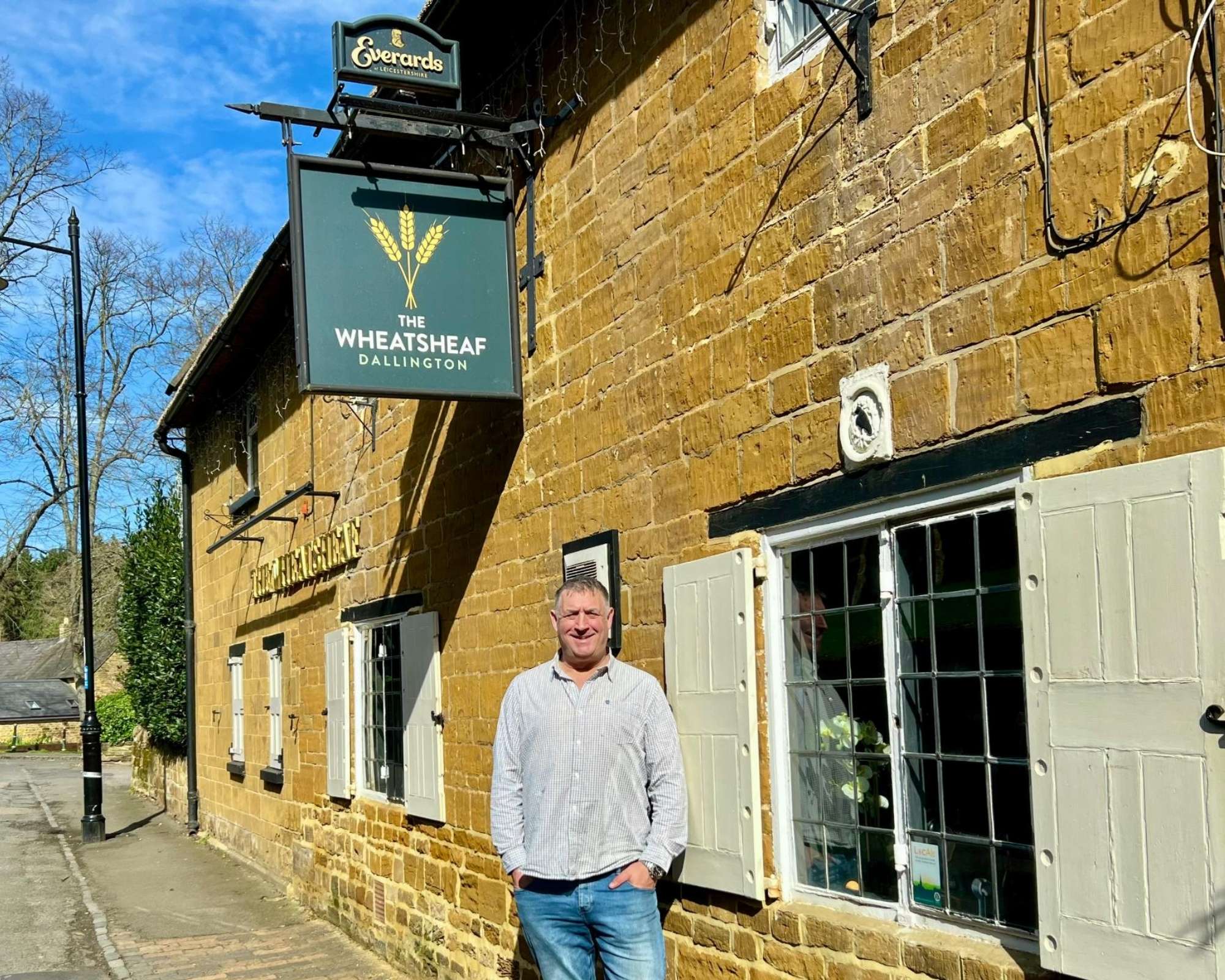 lee outside his pub The Wheatsheaf in Dallingotn